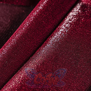 Close-up of deep red velvet satin fabric used in the Miss Pomegranate Little Girl cosplay dress, showing shimmer and texture