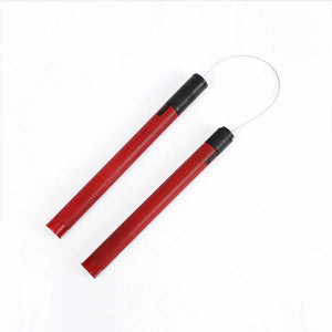 Red nunchuck prop for Matt cosplay, two red textured sticks connected by a wire chain.