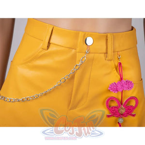 Close - up of a silver chain and pink decorative ornament on Mira’s yellow cosplay skirt.