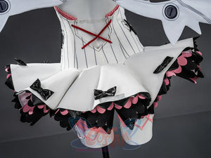 Nangong cosplay flat lay showing bodysuit top with red cross straps and ruffled shorts