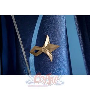 Neuvillette cosplay coat detail with gold star-shaped decorative pin on navy blue sleeve fabric