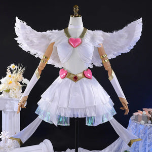 Panty cosplay costume with white angel wings spread out, featuring white layered dress, pink heart accessories, and golden arm bands