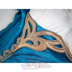Ruan Mei cosplay costume bronze ornate mask placed on teal dress fabric, showing its curved decorative design.