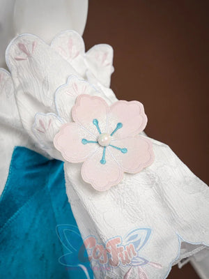 Ruan Mei cosplay costume pink plum blossom applique with blue embroidered stamens and pearl center on white sleeve.