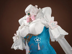 Ruan Mei cosplay costume upper body three-quarter view with white sleeves, pink flowers, green gem, and teal bodice.