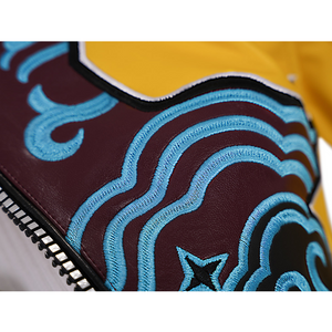 Rumi Cosplay Costume, blue patterns embroidered on a brown PU leather base.