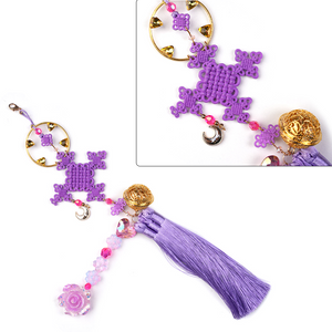 Rumi cosplay costume, pendant featuring a purple ornament, small flowers, a gold medallion, and a lavender tassel.
