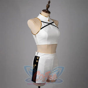 Zippers on the side of the jacket and pants, The top features gold decorative details, two black crisscross straps at the chest area.the pants have black stripes on both sides.