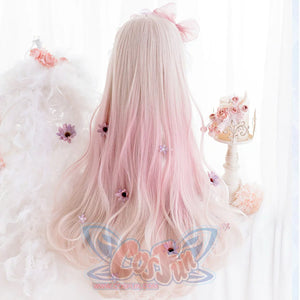 Back view of women's long pink ombre curly synthetic wig on mannequin, 60cm length