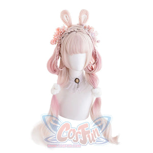 Model wearing long pink ombre curly cosplay wig with white J-Fashion Lolita outfit
