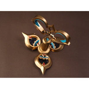 Sandrone cosplay costume back ornament flat lay showing gold piece with teal crescent inlays, red gems, and bell-shaped center