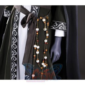 This close-up focuses on the bead detail hanging from the belt of the Sister Friede cosplay costume, featuring a combination of white and brown beads.