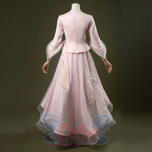 Glinda cosplay costume set featuring pastel pink vintage-inspired gown, ruffled lace cuffs, lace-trimmed sweetheart top, tulle overlay skirt, and necklace. Back side views.