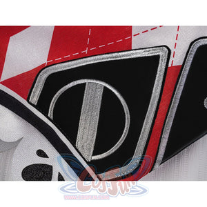 Sparxie cosplay costume sleeve close-up with large black diamond embroidered patch and silver border on red patchwork fabric