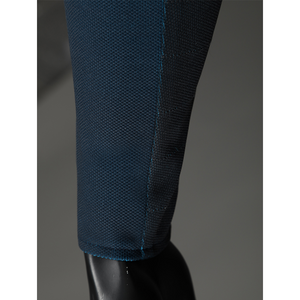 The Fantastic Four cosplay suit pant texture detail showing blue fabric weave and black stitching