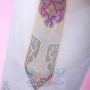 Detailed close-up of the Princess Zelda crest emblem on the cosplay sheer skirt, with multicolor print in pink, gold, and gray on white.