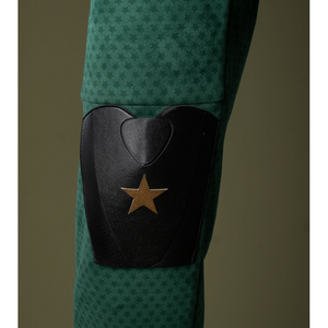 There is a black leather knee guard with golden star patterns on it.