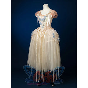 Enid Sinclair Gala dress left side view showing blue floral embroidery, ribbon bow detail, cream tulle layers