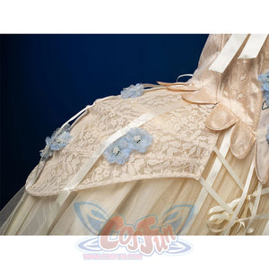 Enid Sinclair Gala dress side view with cream lace trim, blue floral appliques, ribbon bows, layered tulle ball gown skirt