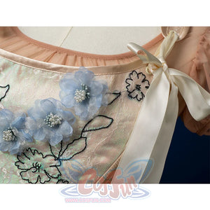 Enid Sinclair Gala dress vest detail with blue floral embroidery, pearl centers, cream ribbon ties, embroidered leaves