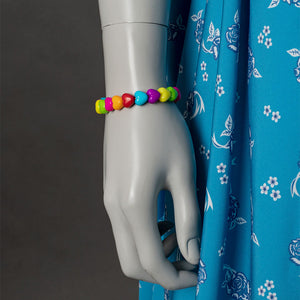 Wheeler cosplay costume accessory detail with colorful beaded bracelet and blue floral dress