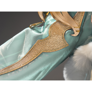 Zibai cosplay costume applique detail showing gold embroidered wing design on teal fabric