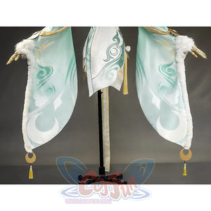 Zibai cosplay costume dress hem with teal swirl patterns, white fur trim, and gold tassel ornaments