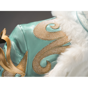 Zibai cosplay costume shoulder detail featuring teal fabric with gold swirl embroidery and fur trim