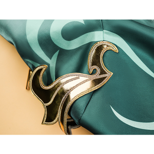 Zibai cosplay costume shoulder accessory with gold metallic trim on turquoise fabric background