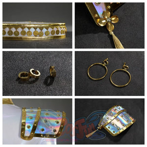 Features a collection of Zoey’s costume accessories: gold - coin belt, flower - shaped brooch with tassel, hoop earrings, and iridescent shoulder pads.