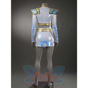 Reveals the back of Zoey’s outfit, featuring blue patterns on the skirt, gold trims, and the iridescent sheen of the entire ensemble.