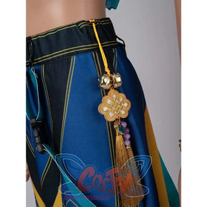Close - up of a gold - tasseled waist charm with beads and floral design, attached to Zoey’s cosplay pants.