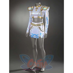 Highlights the front of Zoey’s outfit—glossy fabric, gold - trimmed top, and skirt with chain details, emphasizing its elaborate craftsmanship.