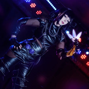Cosplayer wearing Zoey cosplay KILLER black suit with metal chains, purple ornaments, and leather pants