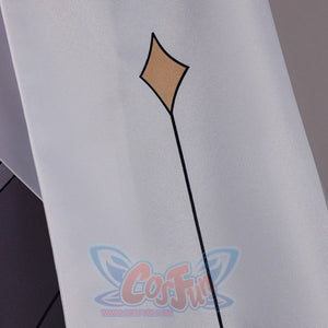 Close-up of Genshin Impact Aether cosplay costume sleeve with white fabric, gold diamond motif, and black line detail