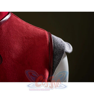 Ahsoka Tano cosplay shoulder guard detail sets a gray textured cap against red dress fabric.