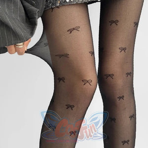Brown sheer summer tights with bow patterns, full-length view in business casual style