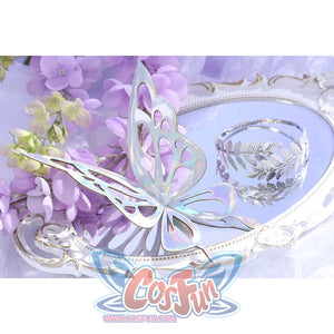Flat lay of Castorice cosplay costume back chain with silver butterfly wing piece, branch motif, and clear bead