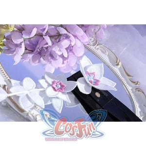 Close-up of Castorice cosplay costume belt flowers with white petals, pink centers, black strap, and silver snaps
