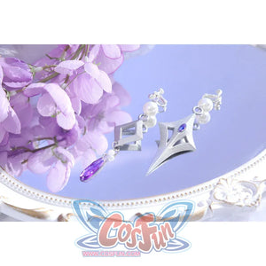 Flat lay of Castorice cosplay costume earrings with silver wing shapes, pearl beads, and purple teardrop charm