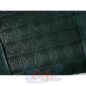 Doctor Doom cosplay chest detail with raised square motifs across the green panel.
