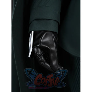 Doctor Doom cosplay glove detail with a silver-tone cuff piece beneath the green sleeve.