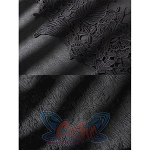 Close-up of black suede-like costume fabric with raised floral lace applique and textured material detail.