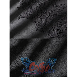 Close-up of black suede-like costume fabric with raised floral lace applique and textured material detail.