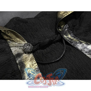 Close-up of the black cape clasp and cord on the Fire Keeper cosplay, highlighting textured fabric and metallic trim.
