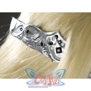 Close-up of the Fire Keeper silver mask side band with sculpted texture and black gem accents over blonde hair.