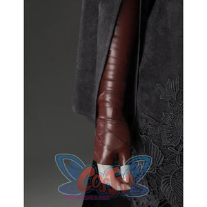 Close-up of the Fire Keeper costume sleeve and brown glove, with black embroidered skirt panel visible at the side.