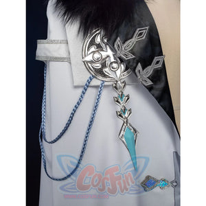 Genshin Impact Il Dottore cosplay cape anchors an intricate silver buckle beside turquoise gem accessories.