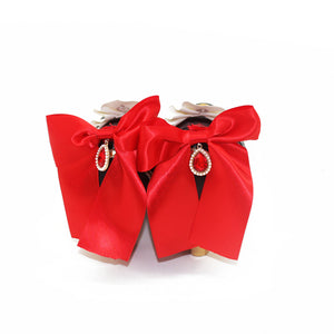 Genshin Impact Marionette Sandrone cosplay shoes anchor large red bows with teardrop accents upon the heels of the pair.