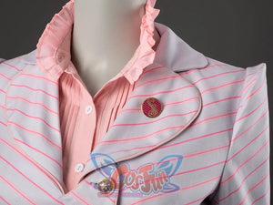 Glinda cosplay blazer close-up with a striped lapel set over a ruffled pink blouse and round brooch